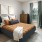 a bedroom with a bed and a lamp