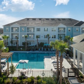 Find your perfect fit at The Hudson pool area with tropical landscaping and ample seating