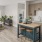 a kitchen with a bar stool and a table