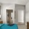 a bedroom with a bed and a desk